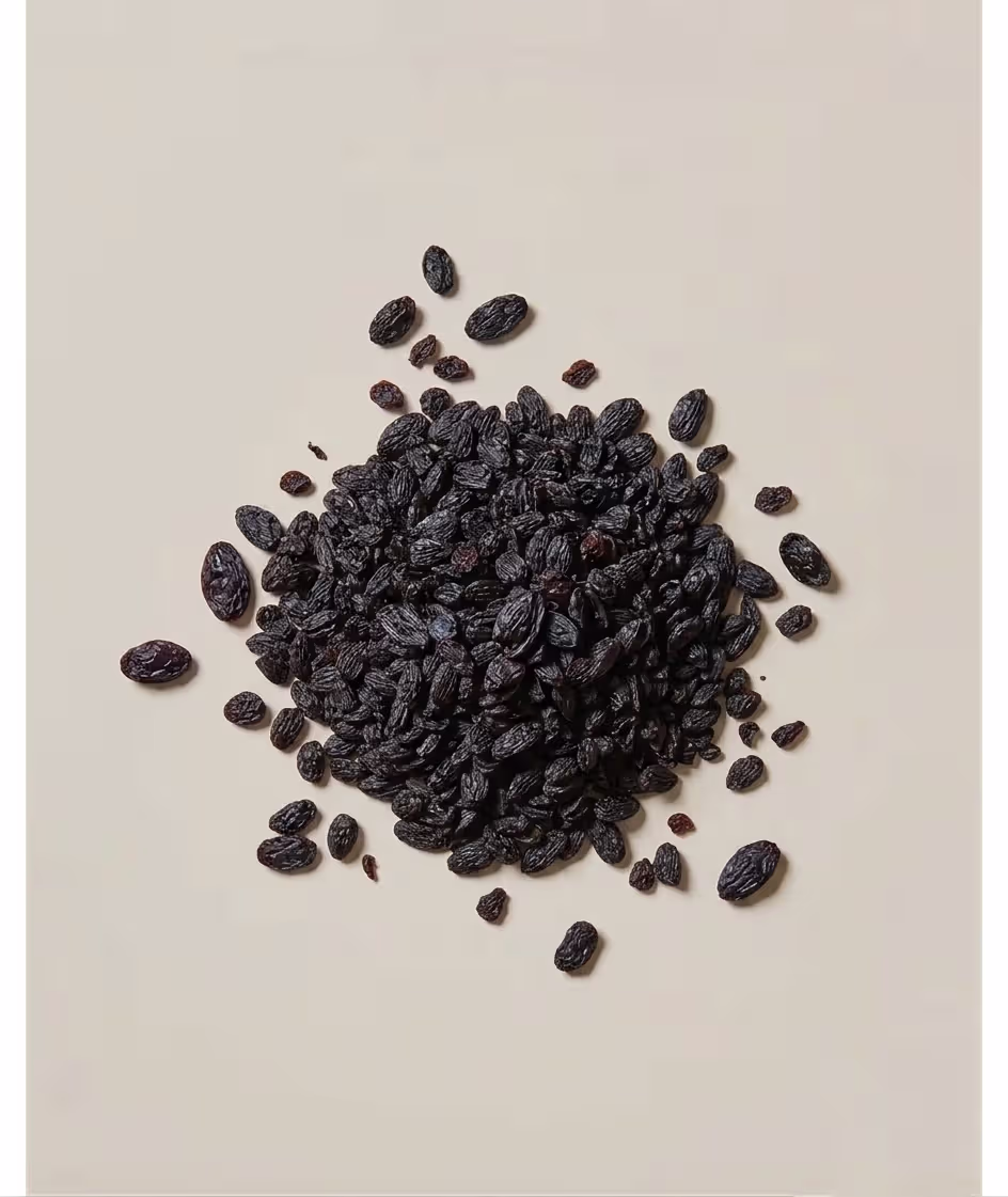 Wooden bowl filled with raisins